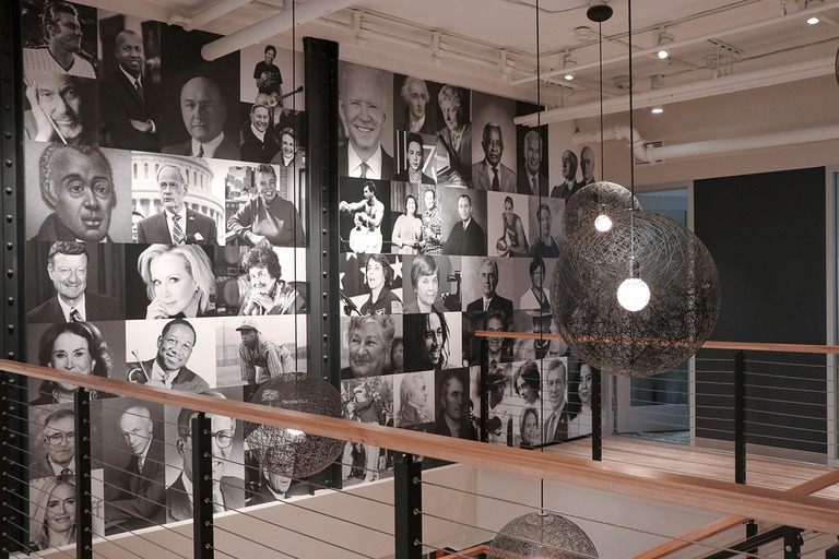 The photo wall on CSC Station's stair landing